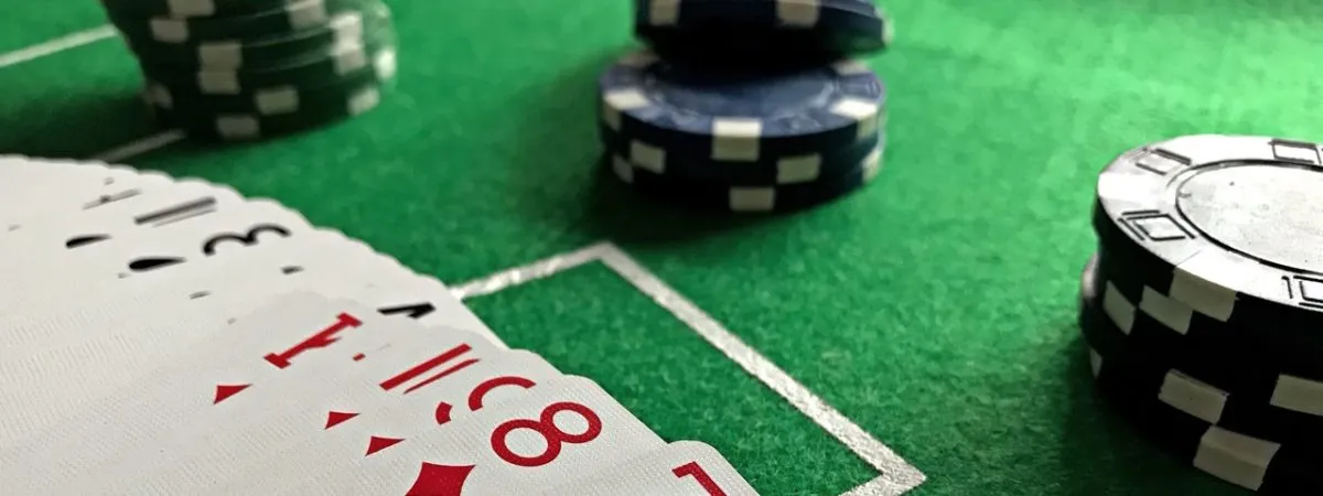 A player with a smartphone showing a sleek, glowing sign-in screen framed by elegant lights — highlighting secure 8JJBET account management in BD